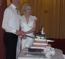 Dean & Joanne use sabre to cut wedding cake Portrush 8th September
